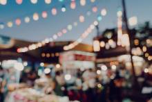 blurry string lights at a night market