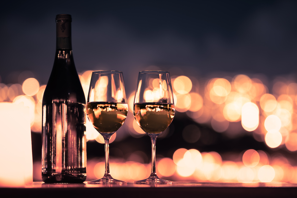 romantic dinner view of wine glasses and bottle