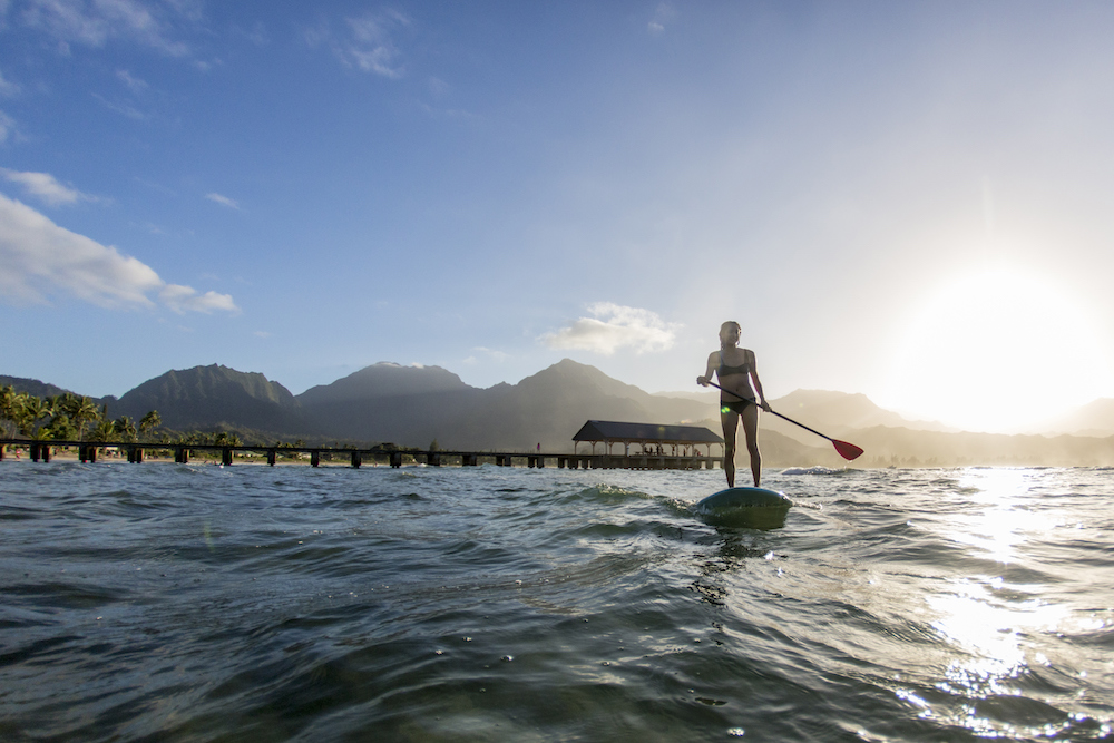 Woman stand up paddleboarding 